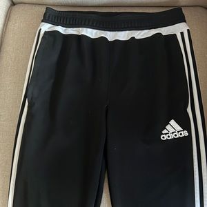 Black with white stripe joggers kids.  Zipper pockets and ankles.